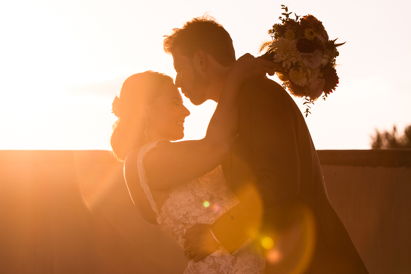 best pa wedding photographer, lisa rhinehart, captures this stunning golden hour image of the couple as they lean in towards each other with the vibrant golden sunset in warfordsburg, pa 