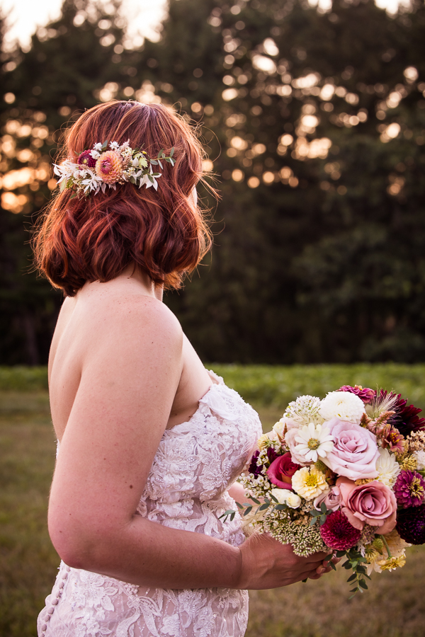 image of this brides hair done by local central pa hair and makeup artist, beauty by khara and vibrant, colorful florals done by greencastle florist, iron willow floral designs