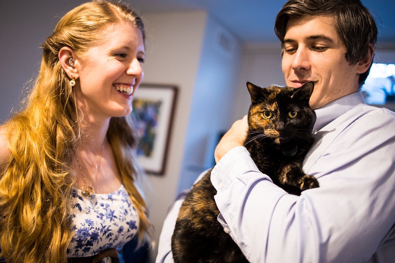 family portrait of the couple with their brown and black colored cat during their philly engagement session 