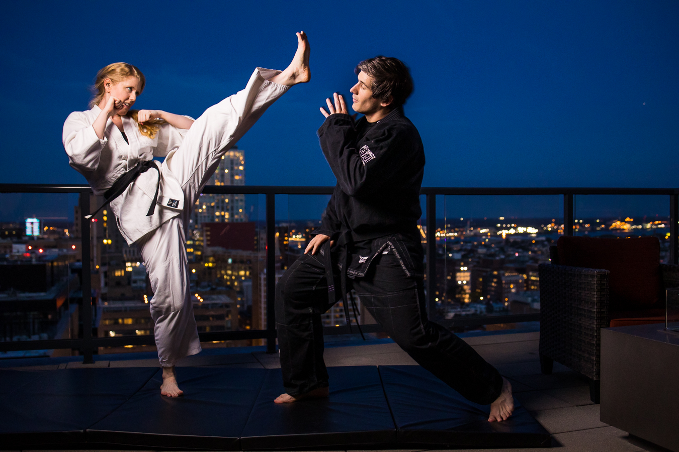 Creative Philadelphia Wedding Photographer, lisa rhinehart, captures this unique, fun, creative image of this couple during their rooftop engagement session doing jiu-jitsu together 