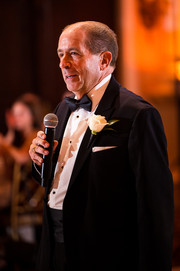 image of the father of the bride sharing his heartfelt wedding speech during the wedding traditions portion of the day 