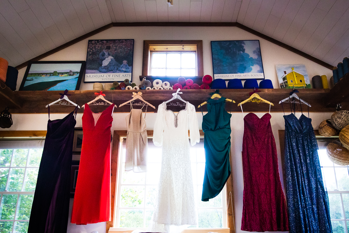The loom room on their farm with wedding and bridesmaids dresses hanging