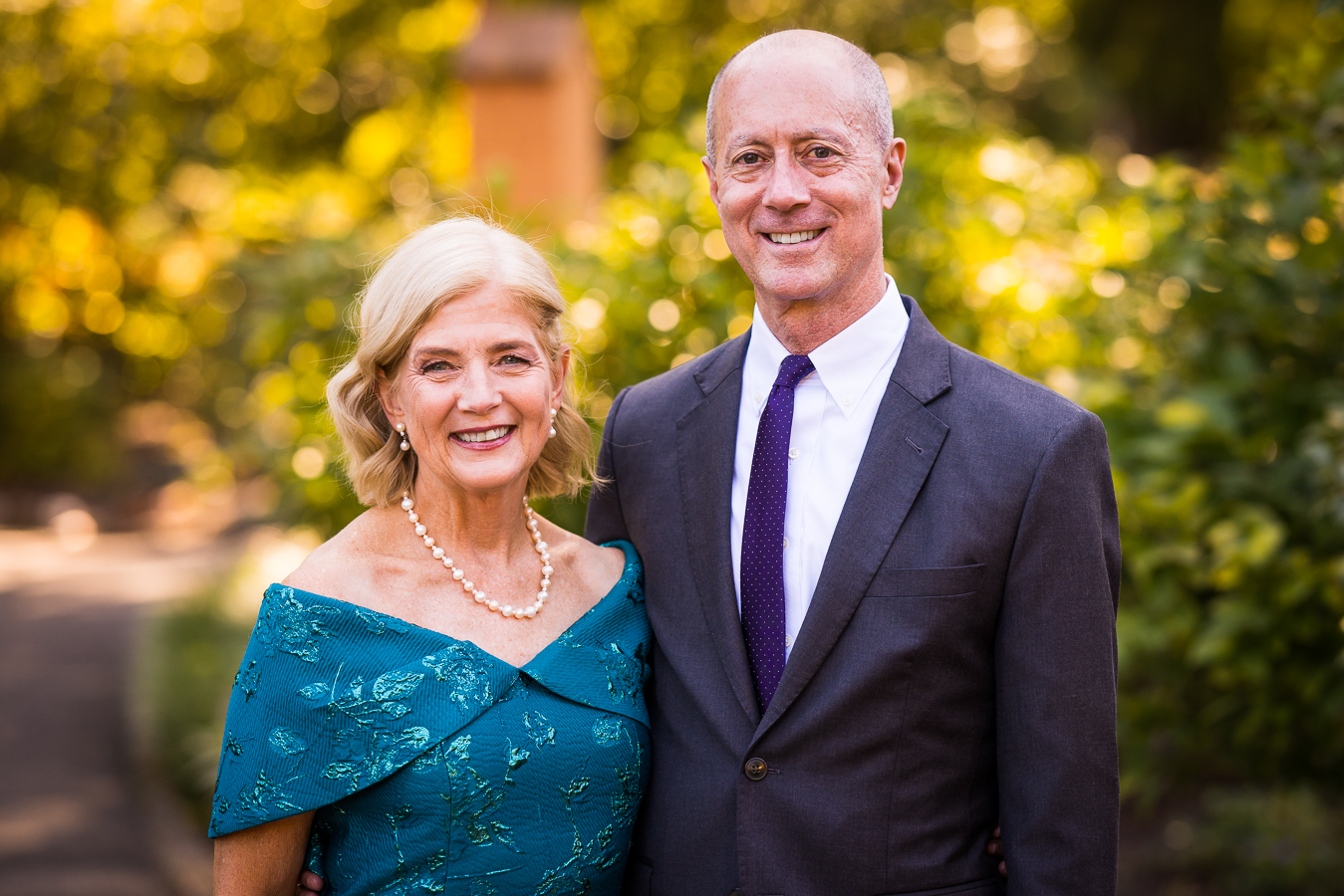 portrait photographer, Lisa rhinehart, captures this traditional portrait of the grooms parents after this multicultural wedding ceremony at st francis hall in dc 