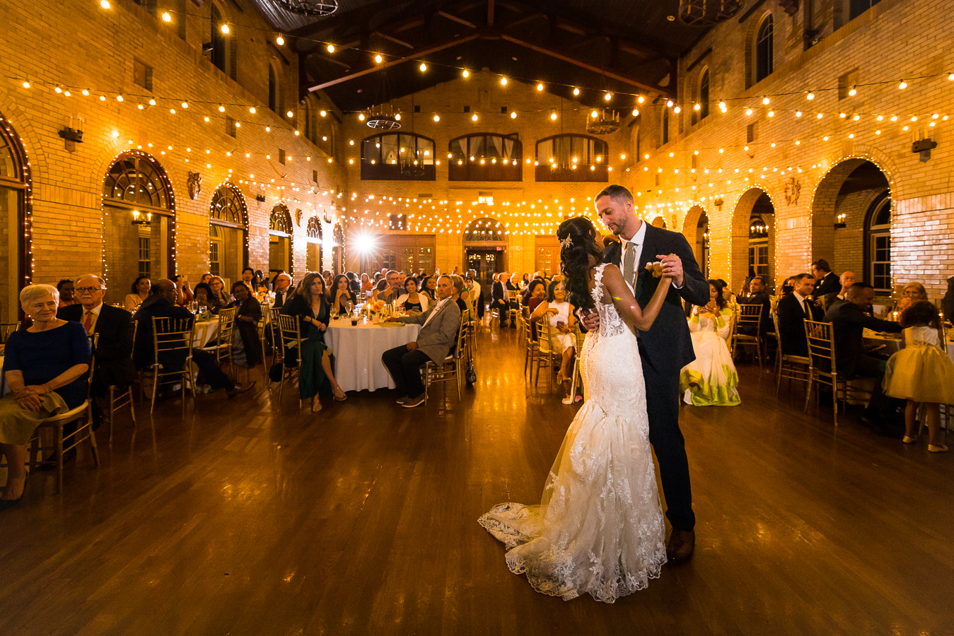 st francis hall wedding photographer, lisa rhinehart, captures this image of the bride and groom as they share their first dance together during their wedding reception in Washington dc