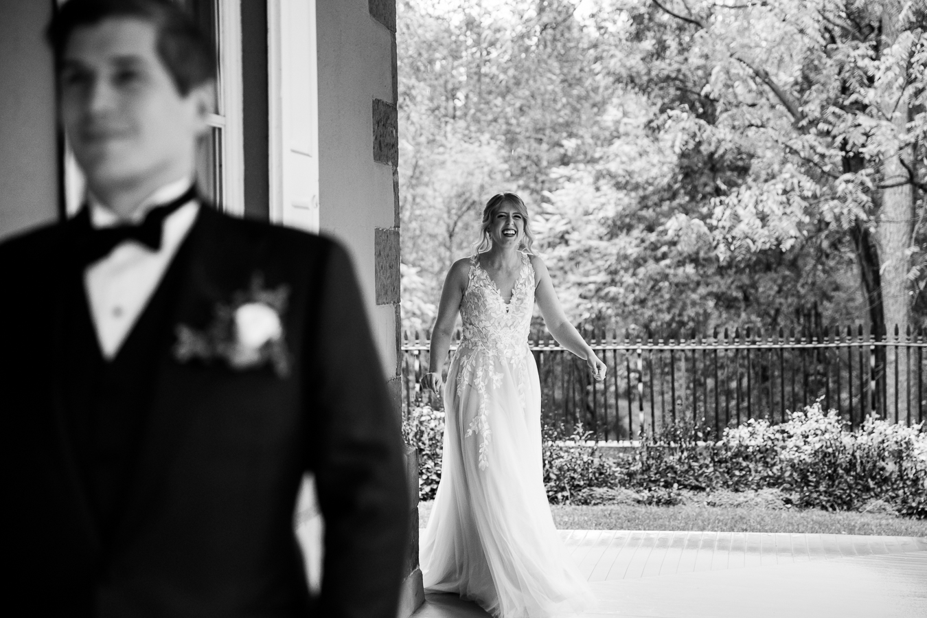 Elizabeth Furnace Wedding photographer, lisa rhinehart, captures this black and white moment as the bride rounds the corner to see the groom for the first time during their first look prior to their ceremony 