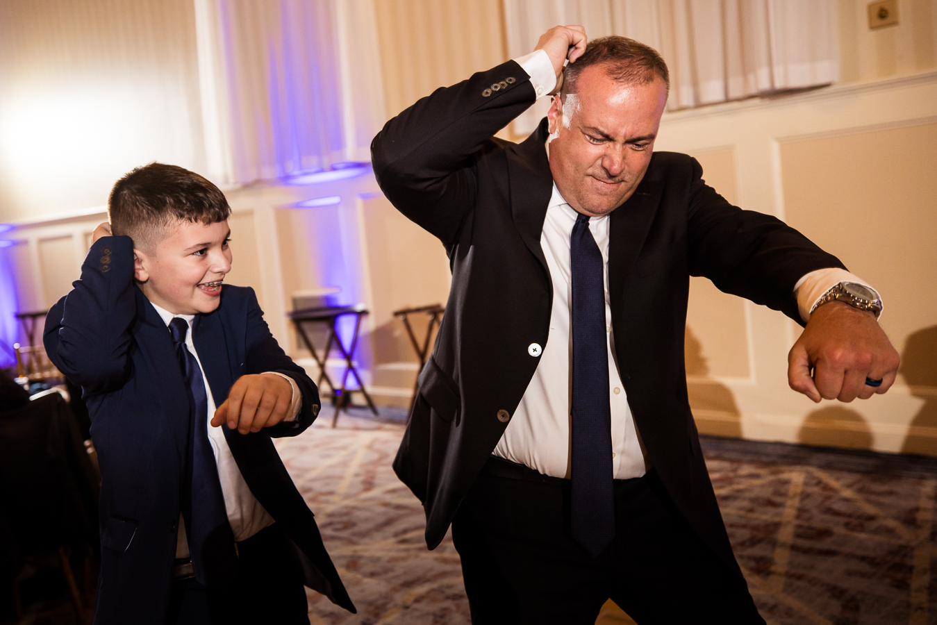 image of guests and a young boy as they bust out their dance moves on the dance floor at this historic wedding venue in central pa