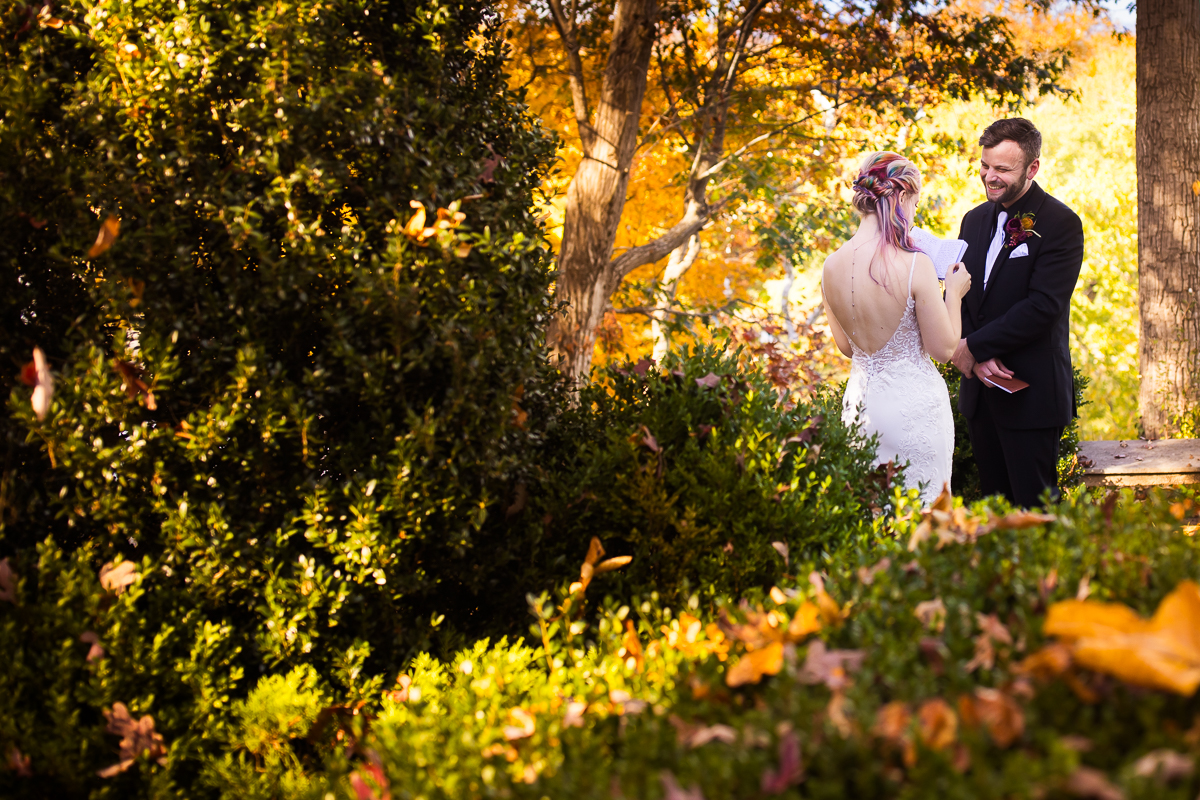 image of the bride and groom as they share their intimate vows before their outdoor wedding ceremony in Leesburg va at Murray hill