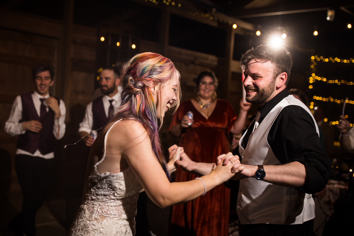 Murray Hill Wedding Photographer, lisa rhinehart, captures this image of the bride and her groom as they dance with one another during this barn wedding reception in Virginia 
