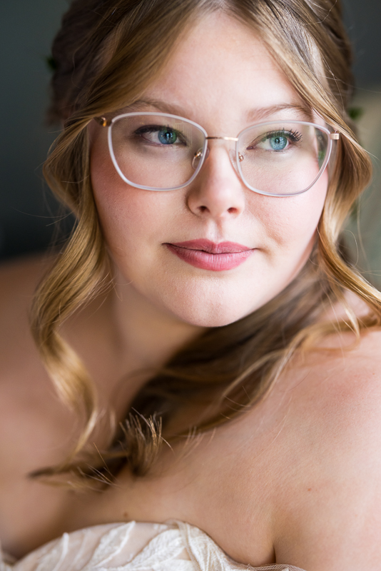 creative Omni wedding photographer, lisa rhinehart, captures this close up bridal portrait of the bride during preparations before their wedding ceremony at the omni at bedford springs 