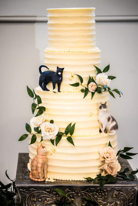 creative Omni wedding photographer, lisa rhinehart, captures this unique, creative wedding cake that features the couple's cats on the cake as a unique wedding cake decor inspo idea 