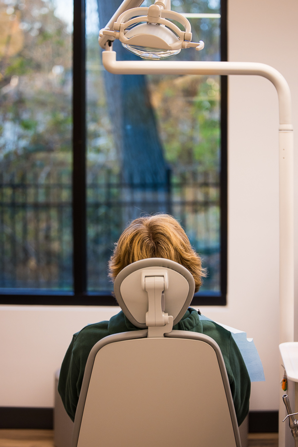 image of a patient from behind sitting in the new fun swivel chairs during their orthodontic appointment in west chester pa with dr ferrell 