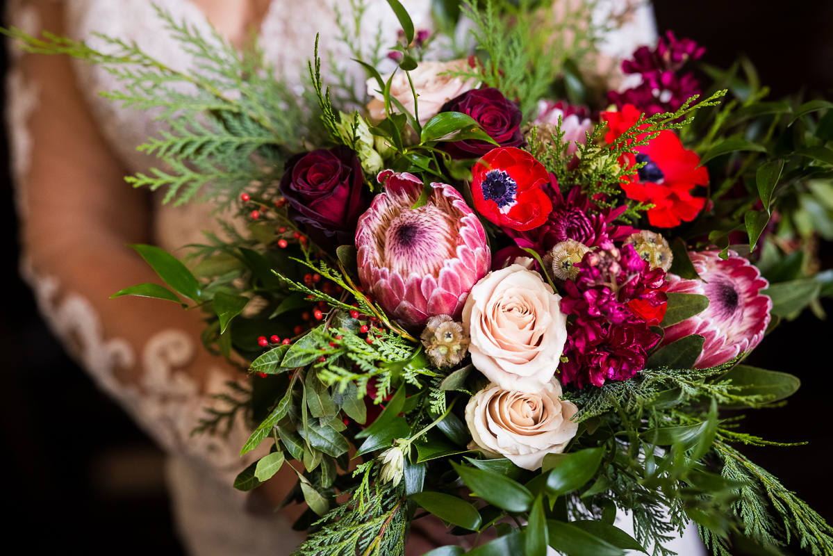 vibrant, colorful, close up image of the bride's bouquet captured by detail wedding photographer, lisa rhinehart