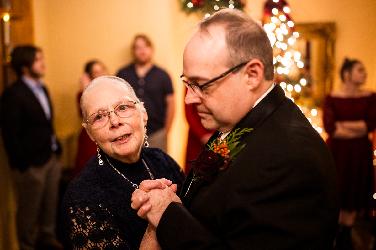 image of the groom and his mom as they share a dance together during this stroudsmoor country inn wedding reception 
