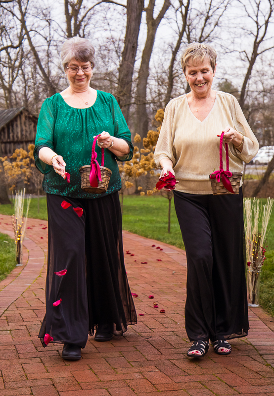 pa wedding photographer, Lisa Rhinehart, captures a unique wedding idea where the bride and groom asked their grandmothers to be their "flower grannies" and lay the flowers down-- how fun! 