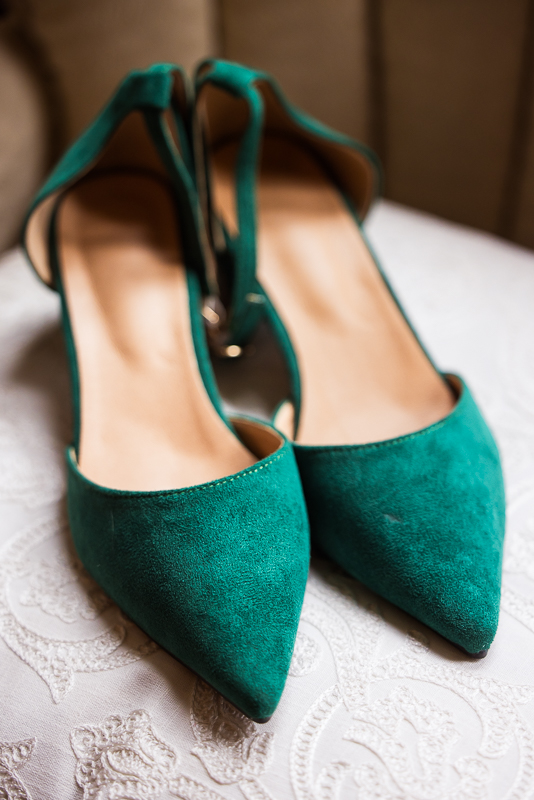 close up detail shot of the green velvet heels worn for this outdoor Christmas wedding in Hallam pa 