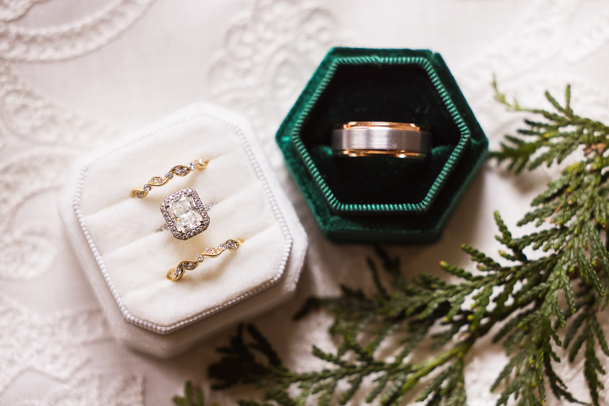 hallam pa wedding photographer, Lisa Rhinehart, captures this close up detail shot of the gold wedding bands in their white and green ring boxes