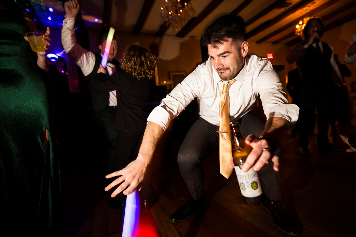Stone Mill Inn Wedding photographer, Lisa Rhinehart, captures this image of guests as they have a great time dancing and partying at this winter wedding reception in Hallam pa 