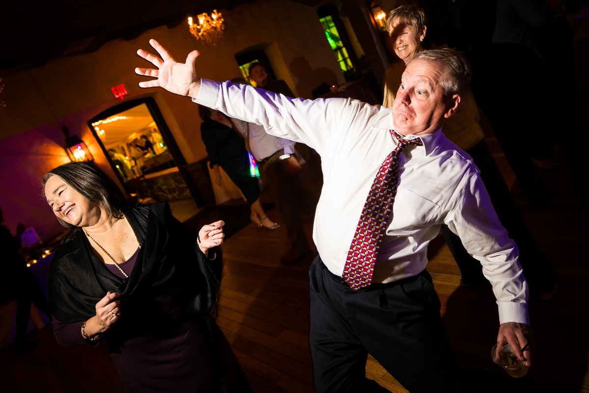candid image of guests as they dance and party at this stone mill inn wedding reception in Hallam pa 
