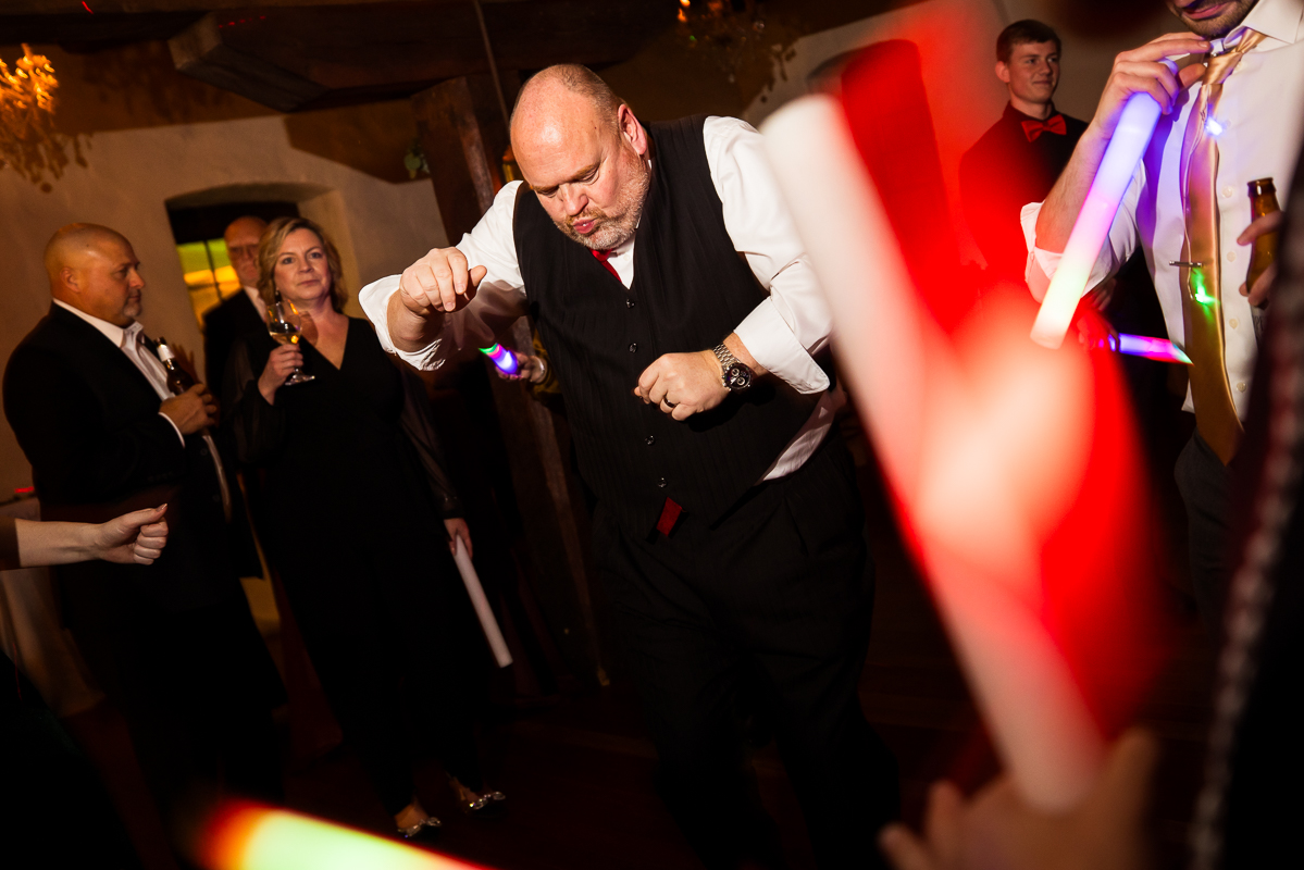 best pa wedding photographer, Lisa Rhinehart, captures this image of family and friends as they dance and have a great time during this Christmas wedding reception in Hallam pa 