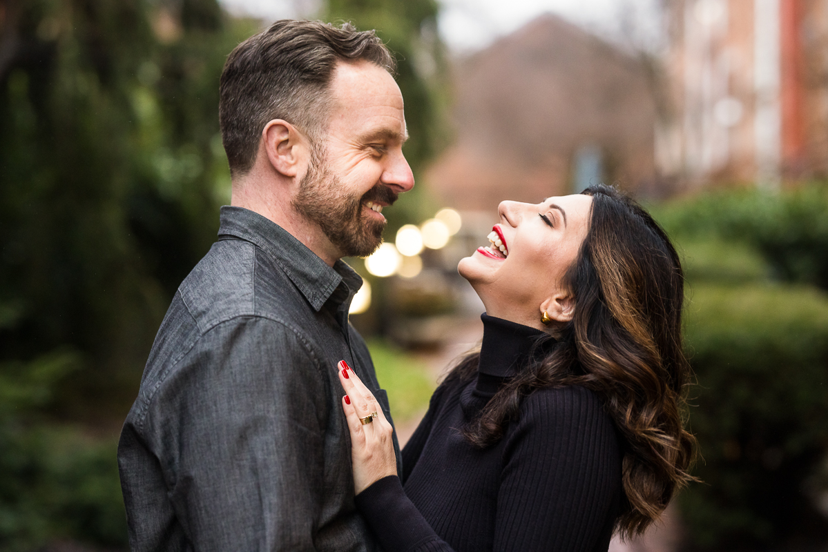 Yorktowne Hotel Wedding engagement photographer, Lisa Rhinehart, captures this fun candid image of the couple as they laugh and smile with one another during this outdoor winter engagement session in York pa 