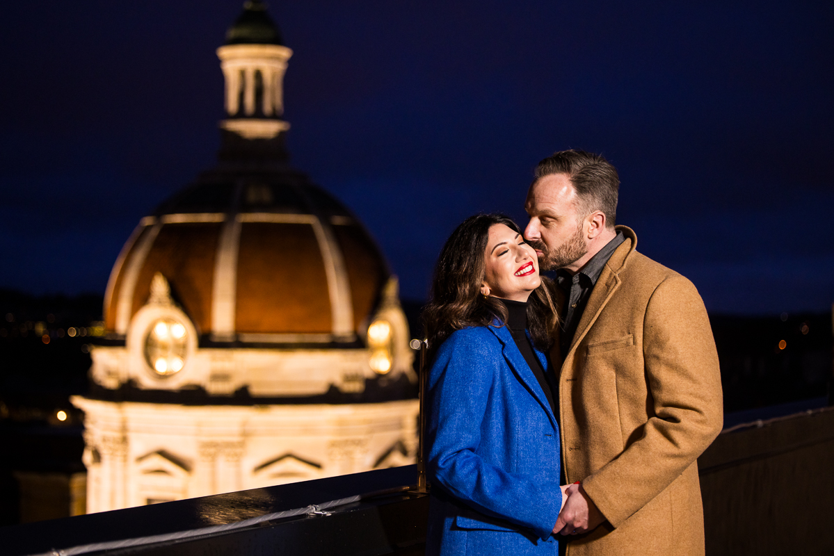 pa engagement photographer, Lisa Rhinehart, captures this image of the couple as they hold hands on the rooftop of the hotel during this outdoor engagement session in York pa 